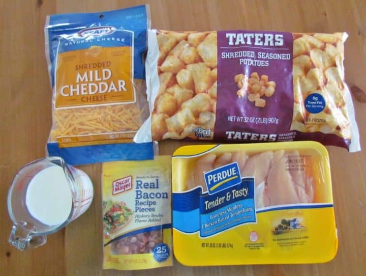 ingredients shown: frozen tater tots
bacon pieces
boneless, skinless chicken breasts
shredded cheddar cheese
milk.